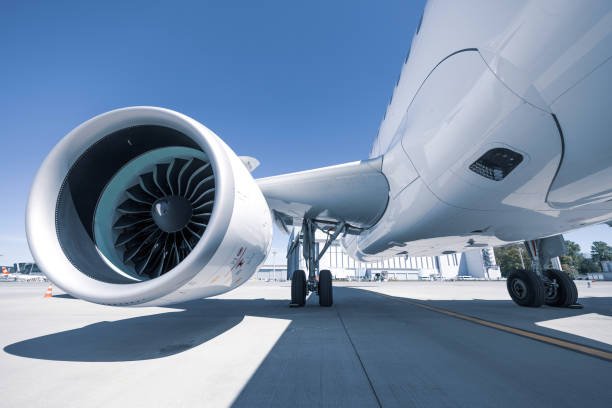aircraft fuselage and engine low angle shot